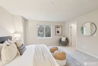 Large primary bedroom with ensuite bathroom, and walk in closet.