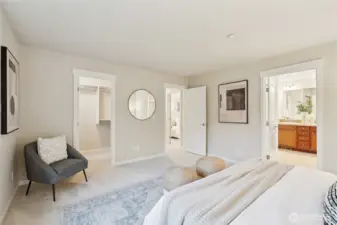 Large primary bedroom with ensuite bathroom, and walk in closet.