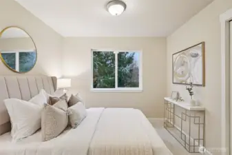Guest room with custom shelving in closet.