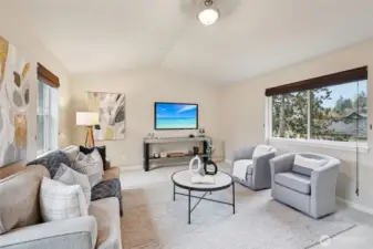 Spacious bonus room with vaulted ceiling has many possible uses.... TV room, play room, office, extra bedroom, workout room, craft room...