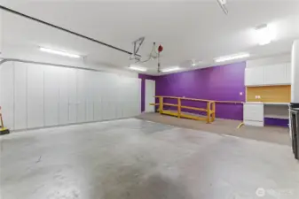 Attached garage with sink and storage