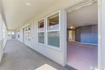 Doors off of deck with doors into den, living room, and dining room.
