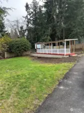 Front yard with asphalt driveway to potential home site