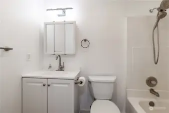 Full bath with single vanity, tub with shower wand & medicine cabinet  Standard smart WIFI connected lighting control  Standard motion sensing switch