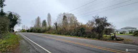 Driveway on right to lot, facing up hill towards lot