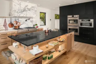 Kitchen showing double ovens, combi oven and warming drawer.