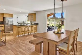 The dining room is adjacent to the kitchen and has access to the covered back patio