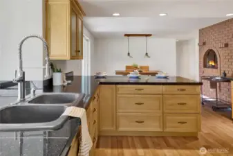 The large kitchen sink overlooks the yard and has abundant counterspace for plants