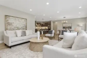 The luxury vinyl plank flooring flows seamlessly throughout the home, providing a touch of modern elegance and a sense of continuity between the spaces.  The dimmable recessed lighting allows you to adjust the ambiance.