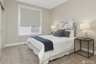 The two generously sized bedrooms, currently showcasing queen beds, offer the flexibility to easily accommodate king-size beds or even two full-size beds in one room.