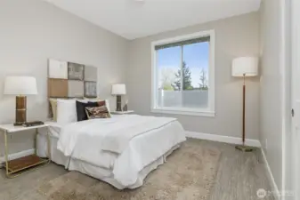 The two generously sized bedrooms, currently showcasing queen beds, offer the flexibility to easily accommodate king-size beds or even two full-size beds in one room.