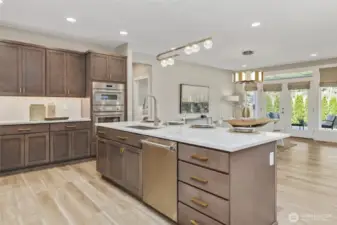 Designed for seamless entertaining, the open layout flows effortlessly around the central kitchen island creating a natural hub for guests to engage with the host.