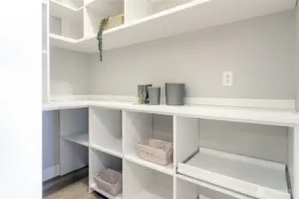 Enjoy the efficiency of a walk-in pantry, thoughtfully designed and installed by California Closets, providing storage you'll truly appreciate.