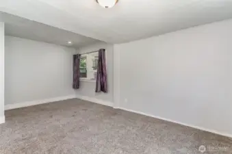 Spacious primary bedroom offers a large closet and a versatile nook—perfect for a reading corner, vanity, or small workspace.