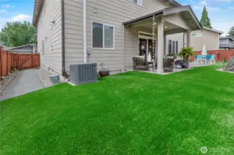Artificial turf is no-maintenance and contributes to an overall tidiness to all sides of this great home!