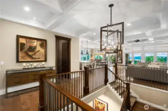 Solid metal balusters line the open staircase