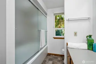 The master bath has a shower/tub combo.
