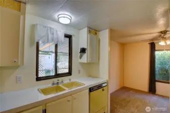 Kitchen with window facing the car port