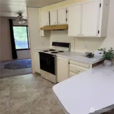 Kitchen with window facing the car port