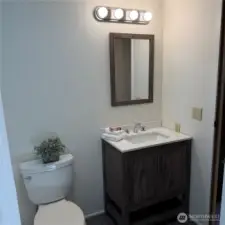 updated bathroom with vanity and mirror