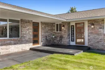 Welcoming entrance with glass-panel front door and separate entrance to the 3rd bedroom.
