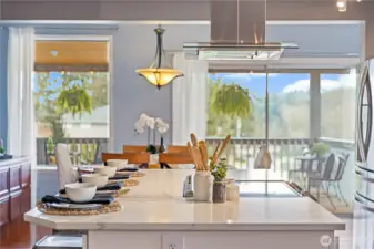 Beautiful open floor plan off of kitchen with views extending over covered porch to the Sound!