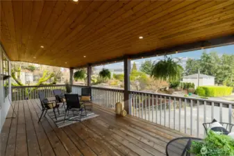 Covered porch is just off of dining area right off of the kitchen.  What an awesome area to extend space for entertaining!