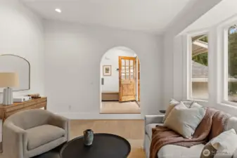 Architectural elegance takes center stage where the grand living room meets a masterfully crafted arched transition.