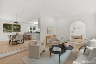 This expansive layout orchestrates a seamless transition from the hearth of the living room to the culinary precision of the chef's kitchen.