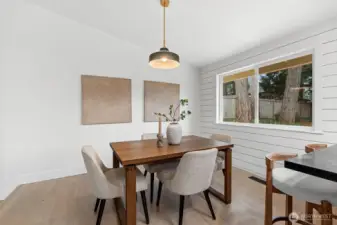 This expansive layout orchestrates a seamless transition from the hearth of the living room to the culinary precision of the chef's kitchen.