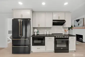 With newly updated tile backsplash elevating this kitchen's workspace, find this stunning space inviting you to culinary creativity.