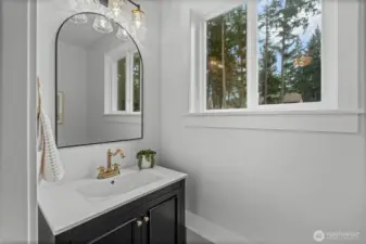 Spare bathroom located off utility room. Private for guests.