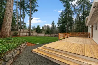Outdoor entertainment just got easier with this homes' vast new wood deck!