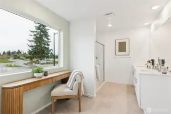 Primary bathroom with step in shower and double vanity with quartz countertops. Actual home is under construction and finishes may vary. See site agent for details.