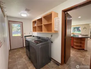 Laundry/ Mud room with newer appliances.
