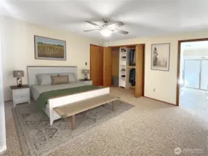Primary bedroom with closet- virtually staged