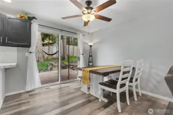 Dining room view, and ceiling fans throughout add to your comfort.