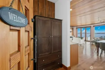 The entry is defined by an immediate connection to the water's edge.