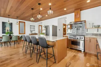 The island anchors the space with generous integrated seating.