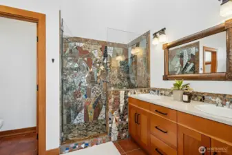 A statement primary bath with layered design elements.