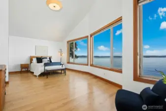 Expansivee primary suite with panoramic views at every turn.