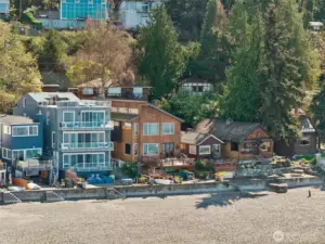 An enclave of residences, tucked behind a canopy of trees.