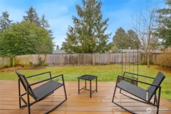 The fully fenced backyard is super private thanks to mature trees. A perfect place to enjoy your morning coffee.