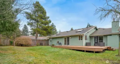 This large, level lot has room for hot tub, fire pit AND a play set! The large Trex deck is newer and perfect for dining al fresco, BBQing, or just enjoying the day. Did we mention the roof is newer, too?