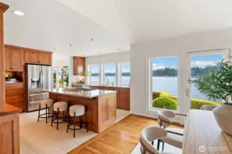 Remodeled chef’s kitchen with spacious walk-in pantry and 5-burner gas range.