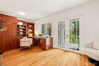 Executive office with built-in desk and cabinets / 2nd bedroom with 3/4 bath on main level.