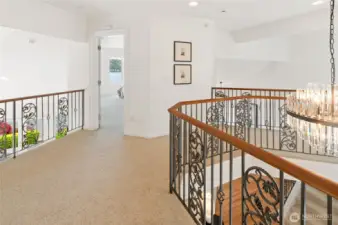 Open layout leading to upper floor bedrooms.
