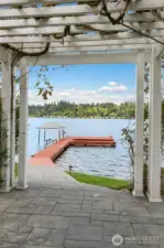 Enjoy fragrant Wisteria leading down to your private dock.