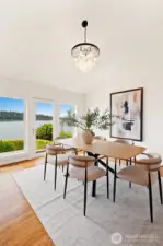 Formal dining room with high ceilings.