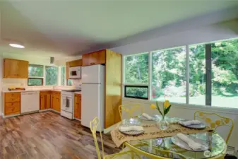 Plenty of space and cabinets here. Lots of windows to enjoy green and private surroundings!